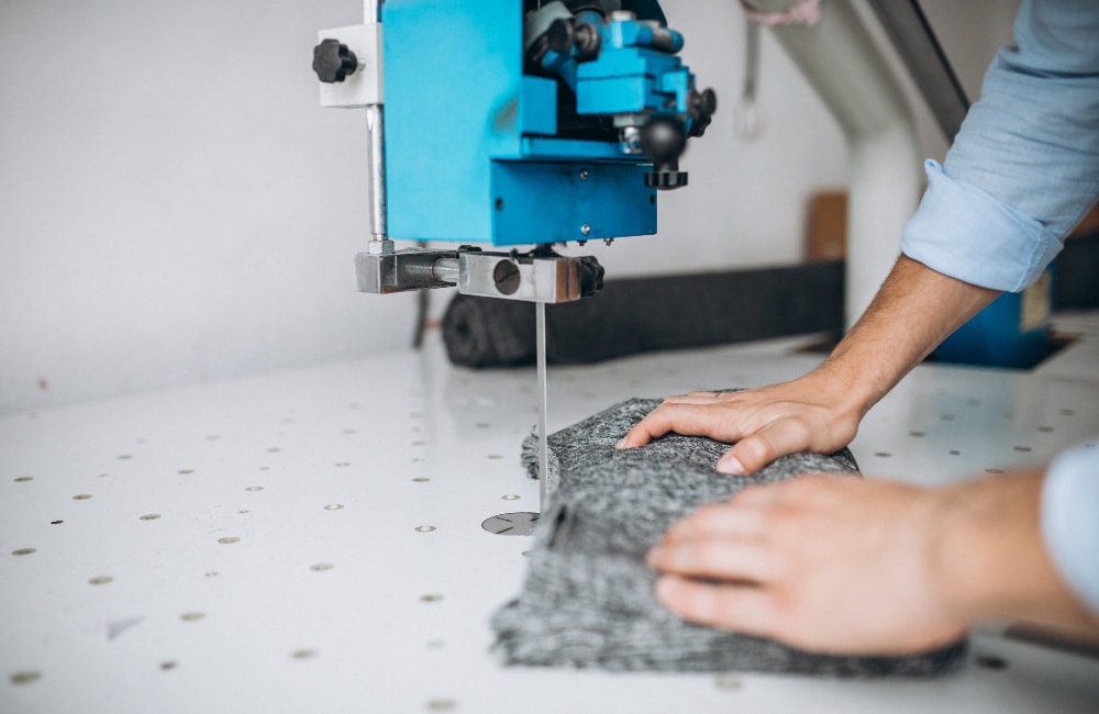 Machine cutting of elastic materials for shapewear