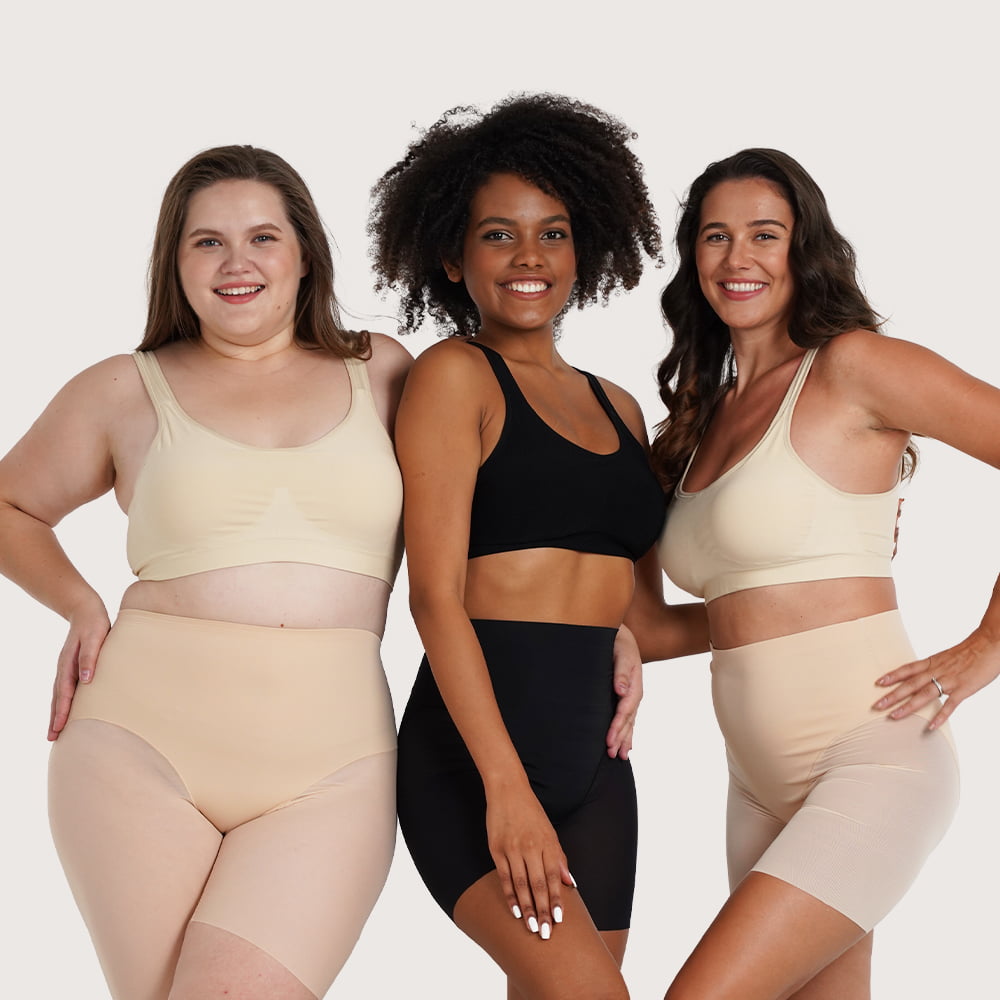 Three women wearing shapewear in different skin tones
