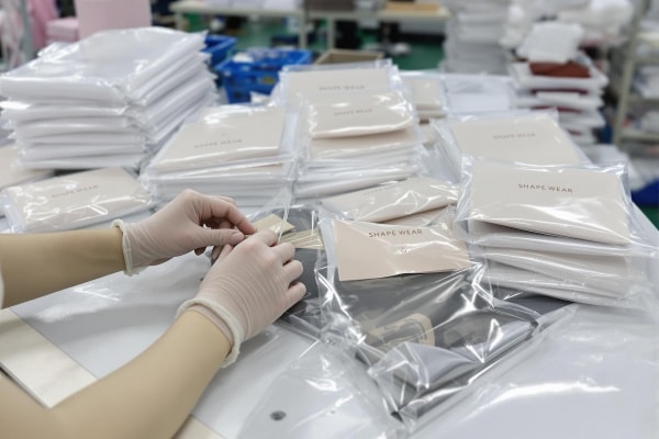 Inspection of packaged shapewear products before shipment